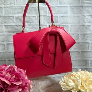 Elegant Pink Handbag with Bow Accent